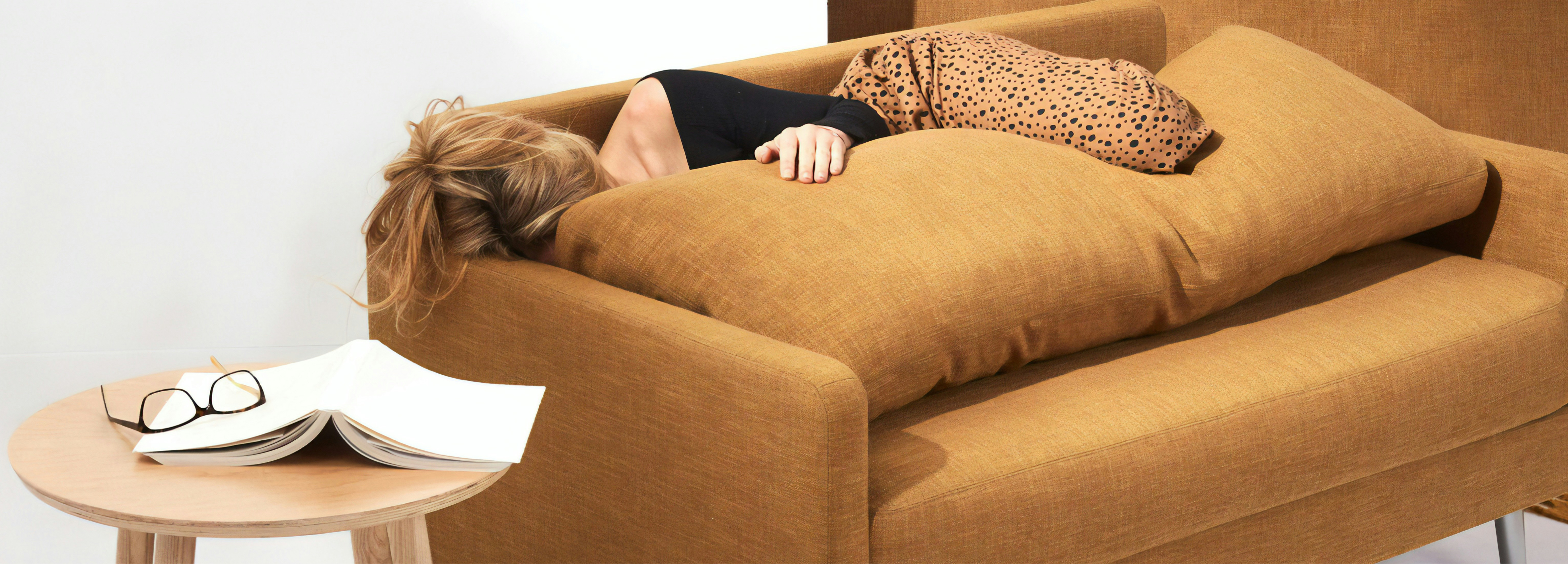 Woman lying on a sofa
